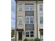 Three-story brick townhome with modern design and neutral color palette at 2651 Stream Nw Ter, Atlanta, GA 30318