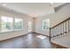 Spacious living room with hardwood floors and large windows at 2651 Stream Nw Ter, Atlanta, GA 30318