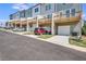 Row of townhomes with attached garages and decks at 2651 Stream Nw Ter, Atlanta, GA 30318