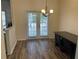 Dining room features French doors leading to backyard, hardwood floors and chandelier at 20 Pine Canyon Sw Dr # 41, Atlanta, GA 30331