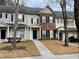 Three-unit townhouse building with sidewalk and lawn at 20 Pine Canyon Sw Dr # 41, Atlanta, GA 30331