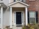 Townhouse entry with black door and white columns at 20 Pine Canyon Sw Dr # 41, Atlanta, GA 30331