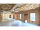 Unfinished basement with high ceilings, framed walls, and ample space at 1050 Wiley Bridge Rd, Woodstock, GA 30188