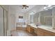 Luxurious bathroom boasting double sinks, a corner tub, and a shower at 1050 Wiley Bridge Rd, Woodstock, GA 30188