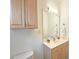 Bathroom with double vanity and updated light fixtures at 1050 Wiley Bridge Rd, Woodstock, GA 30188