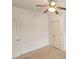 Spacious bedroom with double-door closet and ceiling fan at 1050 Wiley Bridge Rd, Woodstock, GA 30188