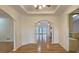 Bright dining room with hardwood floors and arched entryway leading to spacious living area at 1050 Wiley Bridge Rd, Woodstock, GA 30188