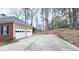 Spacious driveway leading to a two-car garage at 1050 Wiley Bridge Rd, Woodstock, GA 30188