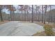Large circular driveway with wooded backdrop at 1050 Wiley Bridge Rd, Woodstock, GA 30188