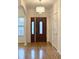 Bright entryway with hardwood floors and chandelier at 1050 Wiley Bridge Rd, Woodstock, GA 30188