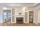 Elegant fireplace with marble surround in the heart of the home's living space at 1050 Wiley Bridge Rd, Woodstock, GA 30188