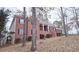 Brick house with a two-story front porch at 1050 Wiley Bridge Rd, Woodstock, GA 30188