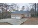 Two-car garage and a long driveway at 1050 Wiley Bridge Rd, Woodstock, GA 30188
