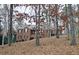 Brick house nestled among tall trees at 1050 Wiley Bridge Rd, Woodstock, GA 30188