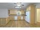 Bright kitchen featuring wood cabinets, modern appliances, and a spacious layout at 1050 Wiley Bridge Rd, Woodstock, GA 30188