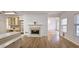 Open kitchen with island, wood cabinets, and views to living room and breakfast area at 1050 Wiley Bridge Rd, Woodstock, GA 30188