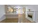 Spacious kitchen with island, hardwood floors, and fireplace at 1050 Wiley Bridge Rd, Woodstock, GA 30188