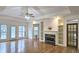 Bright and airy living room with hardwood floors, fireplace, and built-in shelving at 1050 Wiley Bridge Rd, Woodstock, GA 30188
