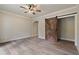 Basement bedroom with barn door and ceiling fan at 100 Percheron Dr, Canton, GA 30114