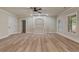 Spacious basement with built-in shelving and hardwood floors at 100 Percheron Dr, Canton, GA 30114