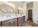 Elegant bathroom with double vanity, soaking tub, and walk-in shower at 100 Percheron Dr, Canton, GA 30114