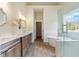 Spa-like bathroom featuring a freestanding tub and glass shower at 100 Percheron Dr, Canton, GA 30114