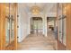 Bright entryway with hardwood floors, a chandelier, and white wainscoting at 100 Percheron Dr, Canton, GA 30114