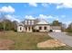 Two-story home with stone and white accents, large yard at 100 Percheron Dr, Canton, GA 30114