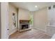 Cozy stone fireplace with wooden mantel and access to screened porch at 100 Percheron Dr, Canton, GA 30114