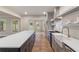 Modern kitchen with gray cabinets, quartz countertops, and a farmhouse sink at 100 Percheron Dr, Canton, GA 30114