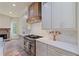 Gourmet kitchen with stainless steel appliances and custom cabinetry at 100 Percheron Dr, Canton, GA 30114