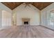 Living room with vaulted wood ceiling, hardwood floors and stone fireplace at 100 Percheron Dr, Canton, GA 30114