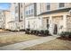 Row of townhomes showcasing inviting front porches and landscaping at 110 Cobalt Dr, Fayetteville, GA 30214