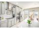 Modern kitchen with white cabinets, stainless steel appliances and breakfast bar at 110 Cobalt Dr, Fayetteville, GA 30214