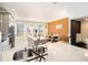 Open kitchen with large island, stainless steel appliances, and an orange accent wall at 110 Cobalt Dr, Fayetteville, GA 30214