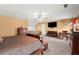 Cozy main bedroom featuring a bed, dresser, couch and lots of natural light at 1579 Howell Highlands Dr, Stone Mountain, GA 30087