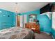 Brightly-colored bedroom with a chandelier, natural light, and a wooden dresser at 1579 Howell Highlands Dr, Stone Mountain, GA 30087