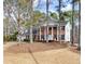 Charming two-story brick home with white columns and a well-manicured front yard at 1579 Howell Highlands Dr, Stone Mountain, GA 30087