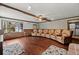 Living room with a row of brown leather recliners and hardwood floors. Bay window with storage at 1579 Howell Highlands Dr, Stone Mountain, GA 30087