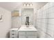 Modern bathroom with white vanity, shower, and updated fixtures at 1590 Ridgebrook Downs, Mableton, GA 30126