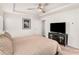 Main bedroom with king bed, TV, and built-in shelving at 1590 Ridgebrook Downs, Mableton, GA 30126