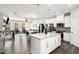 Bright, modern kitchen with a center island flows into the living area and dining area with hardwood floors at 1590 Ridgebrook Downs, Mableton, GA 30126