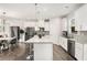 White kitchen with granite countertops and stainless steel appliances at 1590 Ridgebrook Downs, Mableton, GA 30126