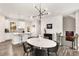 Modern kitchen with white cabinets, granite countertops and island at 1590 Ridgebrook Downs, Mableton, GA 30126