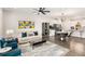 Open-concept living room showcases hardwood floors and seamless flow into the dining area and kitchen at 1590 Ridgebrook Downs, Mableton, GA 30126