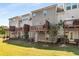 Back exterior of townhomes with private decks and grassy yard at 1590 Ridgebrook Downs, Mableton, GA 30126