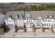 Aerial view of a row of townhouses with gray roofs and attached garages at 2134 Old Georgian Nw Ter, Atlanta, GA 30318