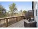 Relaxing deck with wooden flooring, wicker furniture, and tranquil wooded views at 2134 Old Georgian Nw Ter, Atlanta, GA 30318