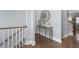 Bright hallway with hardwood floors, a decorative mirror, and a console table at 2134 Old Georgian Nw Ter, Atlanta, GA 30318