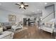 Spacious living room with hardwood floors, fireplace, and large windows at 2134 Old Georgian Nw Ter, Atlanta, GA 30318